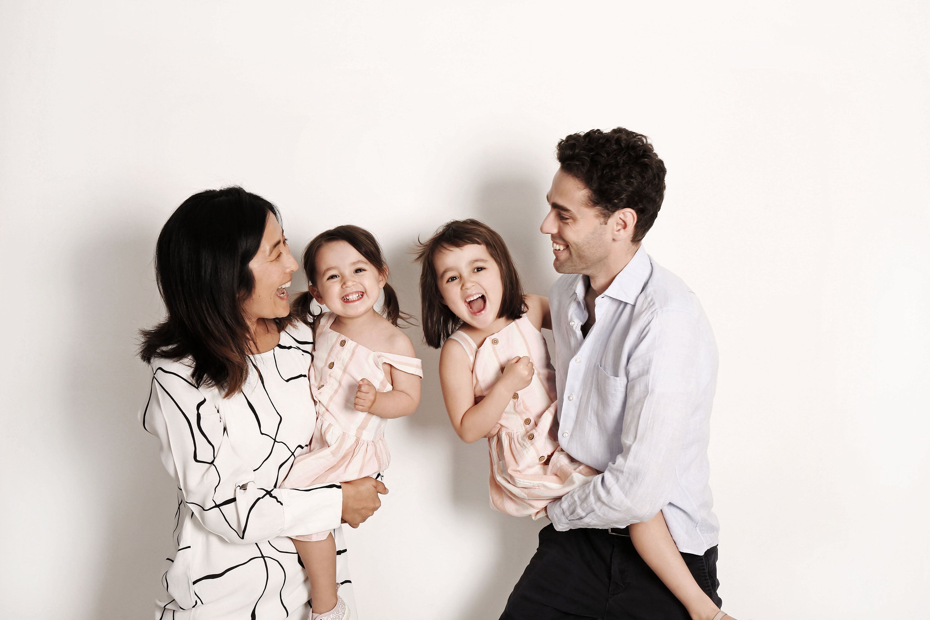 Asian female founder Jennie Gao with her husband and two daughters.