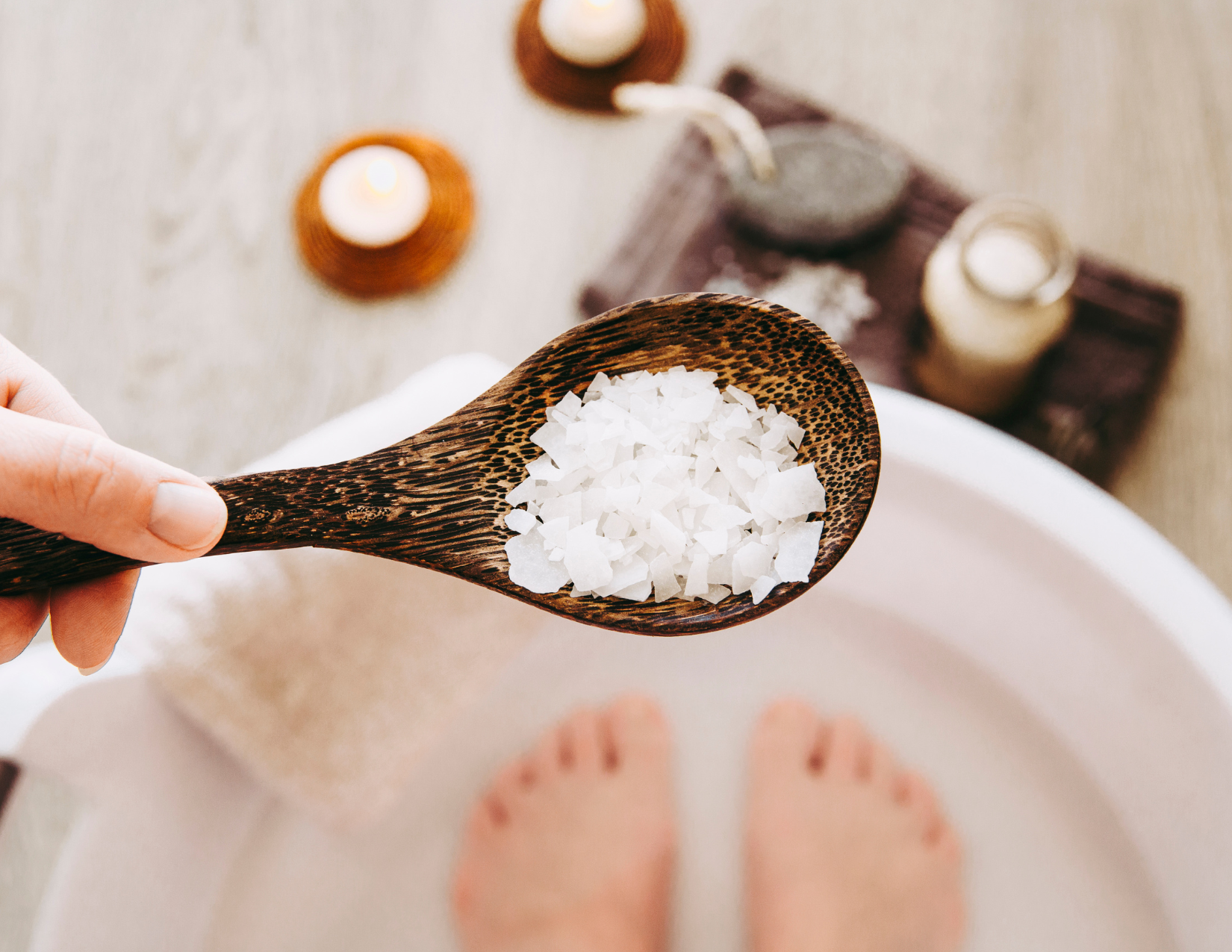woman putting magenisum salts into her bath to up magensium levels naturally