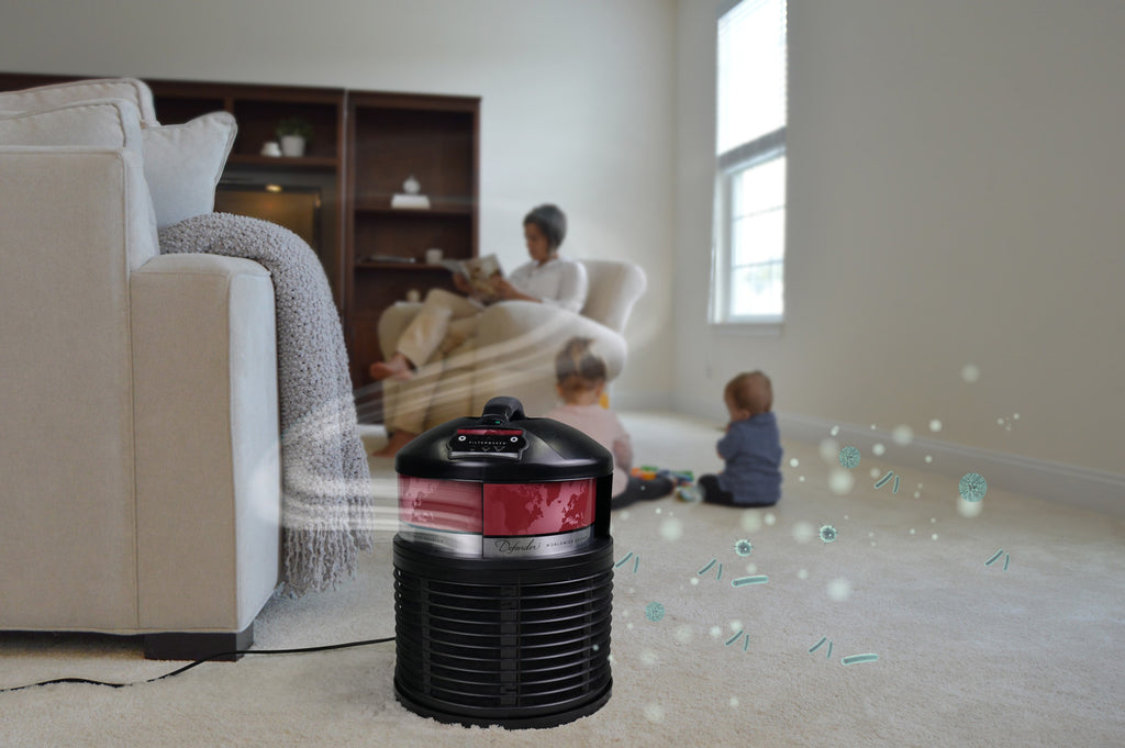 family in room with pollutants and air purifier running