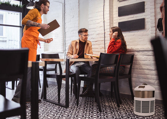 White defender air purifier in restaurant