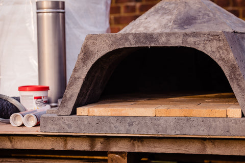 A DIY pizza oven in the during building process