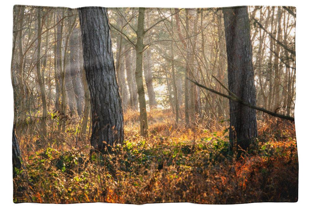 Warme Wintersonne im Wald - Kuscheldecke Howling Nature