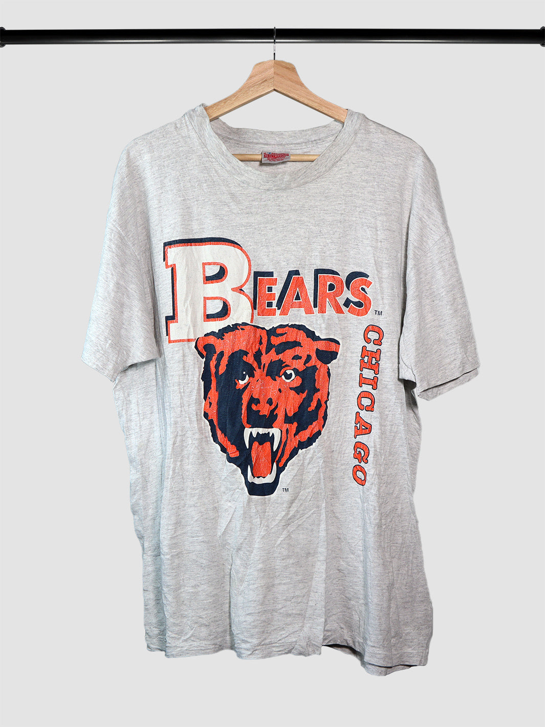 Vintage Chicago Bears football tshirt in gray on a hanger.