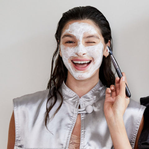 Woman wearing face mask wearing Monii Beauty Cape