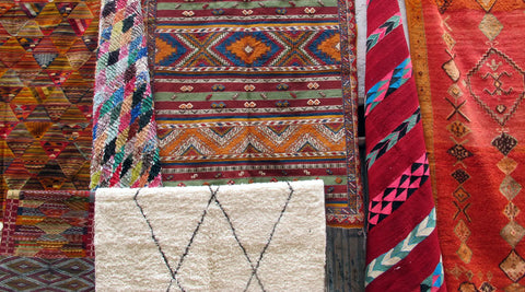 A close up photo of different colorful handmade Moroccan rugs