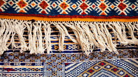 Close up on the tassels of a handmade taznakht rug