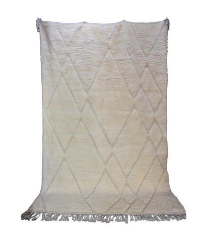 Standing photo of a handmade white Beni Ourain rug