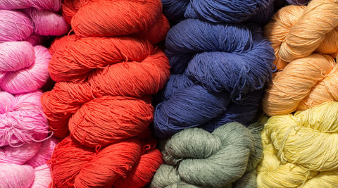 a close-up picture on different colorful wool piles