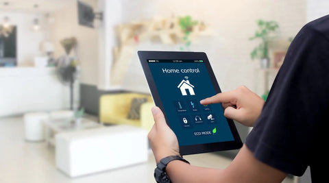 Smart home concept, a tablet-computer monitoring and controlling a home