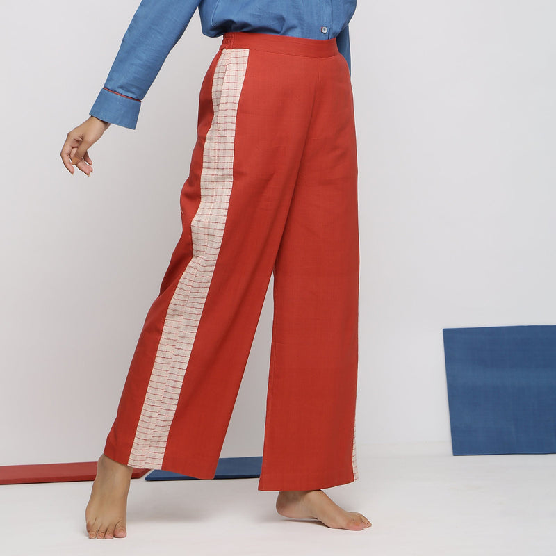Right View of a Model wearing Brick Red Vegetable Dyed Wide Legged Pant