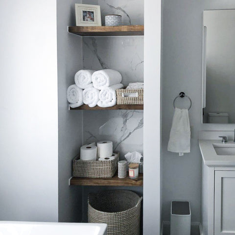 Aged Barrel Rustic Floating Shelves mounted in a bathroom for storage