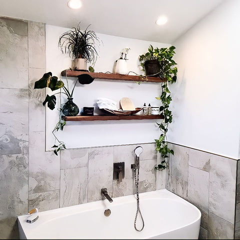 Walnut Floating Shelves mounted above a bathtub