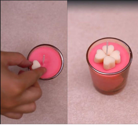 Garnish the candle with wax hearts