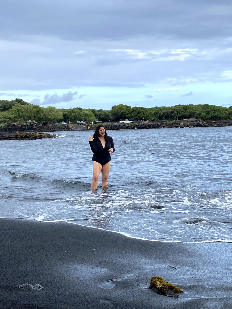Jenny Dayco visits Punaluu black sand beach in Hawaii