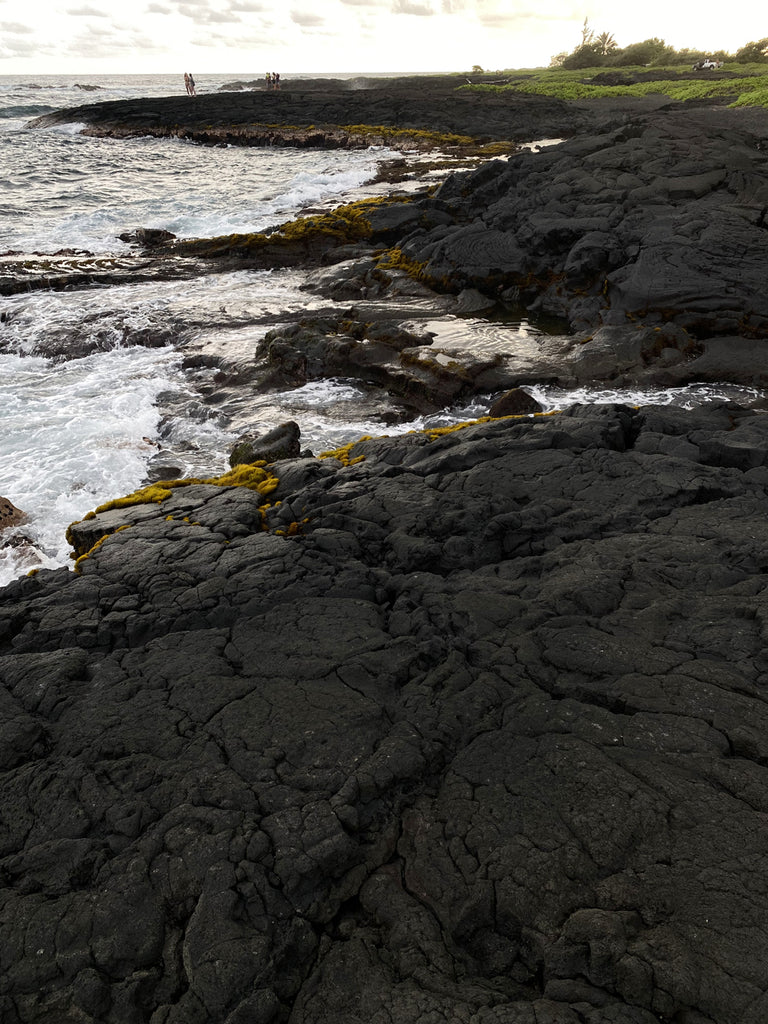 Jenny Dayco visits Punaluu black sand beach in Hawaii