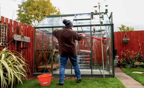Eli washing greenhouse