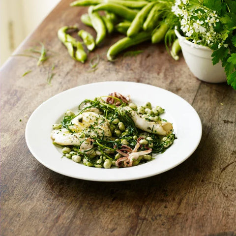 Grilled Squid dish on a wooden table