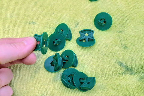Plastic pins for attaching bubble wrap to interior of greenhouse