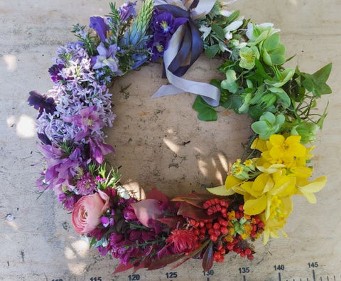Rainbow wreath made with freshly cut locally grown seasonal flowers
