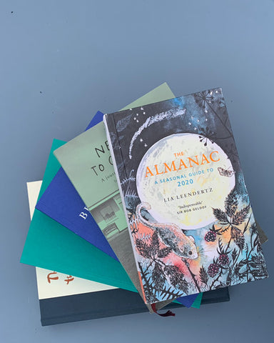 The Almanac: A seasonal guide to 2020. Pile of Books
