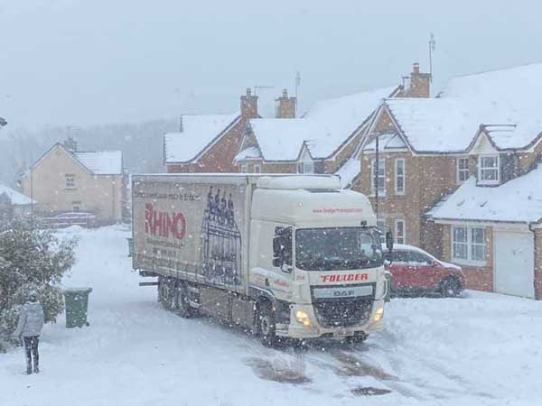Rhino lorry delivering on a snowy day