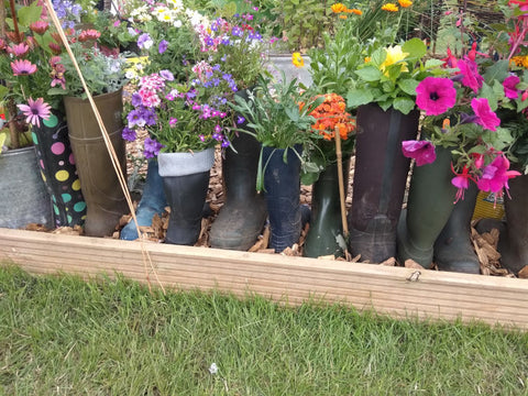 Wellies making fantastic flowerpots at this show garden, alongside our Rhino Greenhouses at the Royal Norfolk Show.