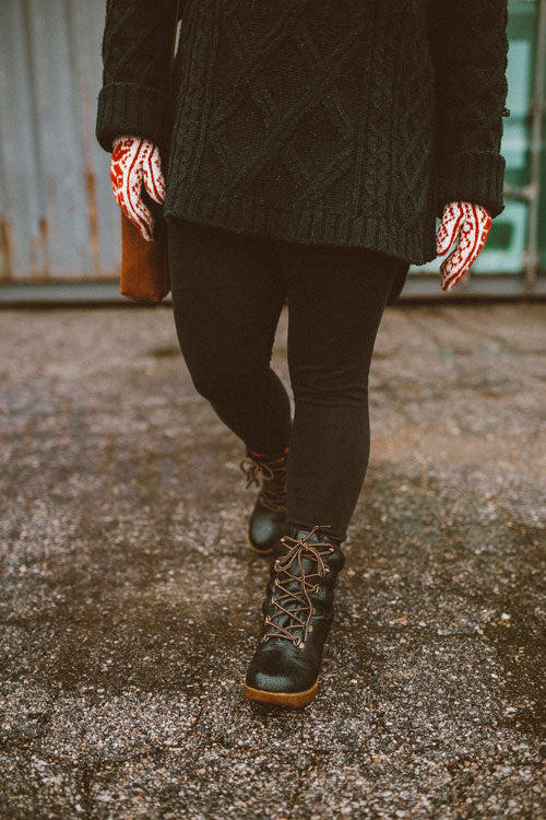 Influencer lower body walking outside in black jeans, red and white mits wearing Cougar Original Pillow Boot in Black