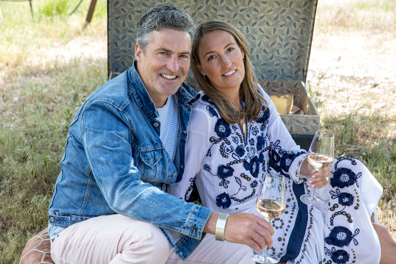 Sarah Bancroft with Husband having a picnic with wine. 