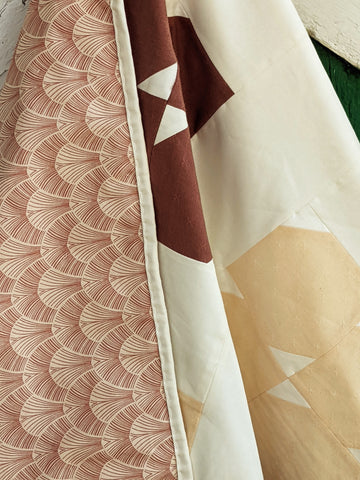 shades of pink and white modern quilt in floral and art deco pattern