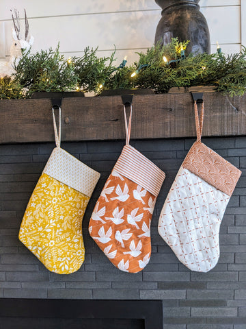 yellow and orange stockings on mantle