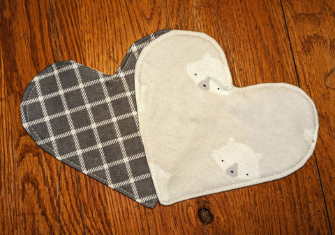 2 flannel hearts on wood