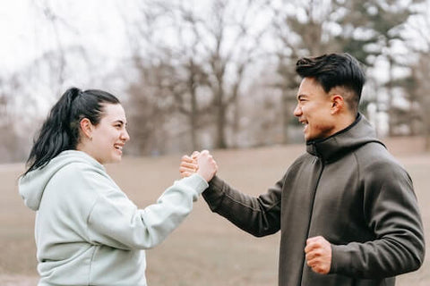 Fitness coach and student talking