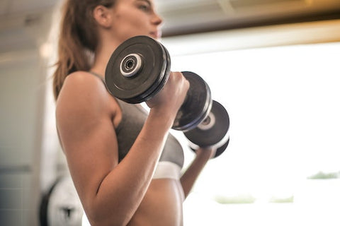 woman working on weight training