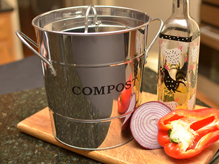 Silver kitchen composting bucket available at Green Living Supply