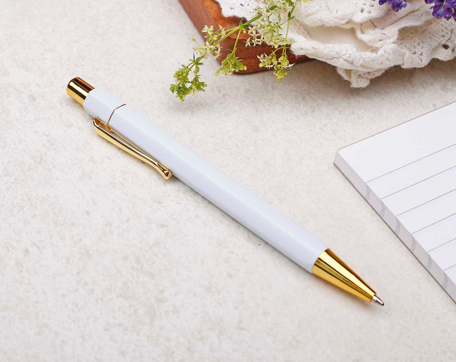 white and gold pen