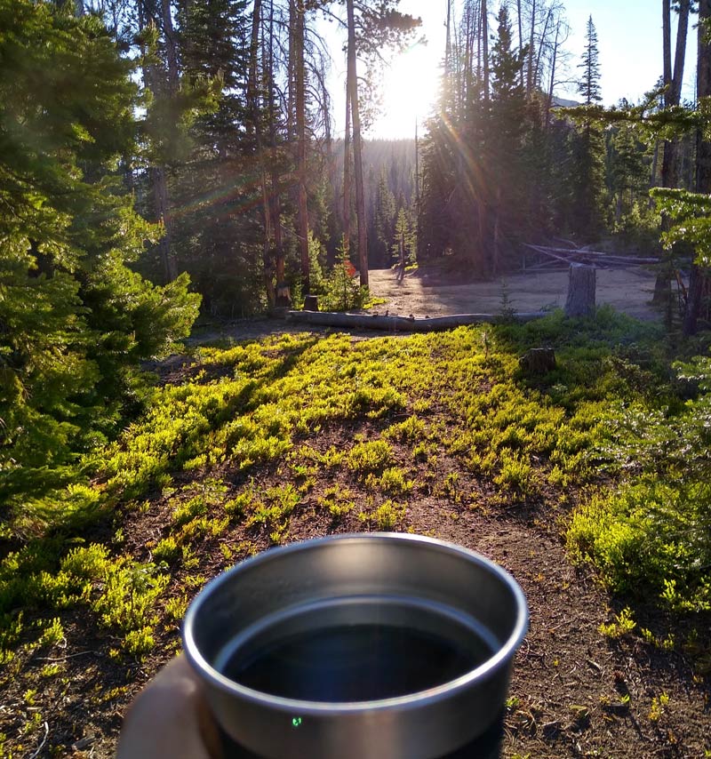 outdoor camping coffee with the sunrise