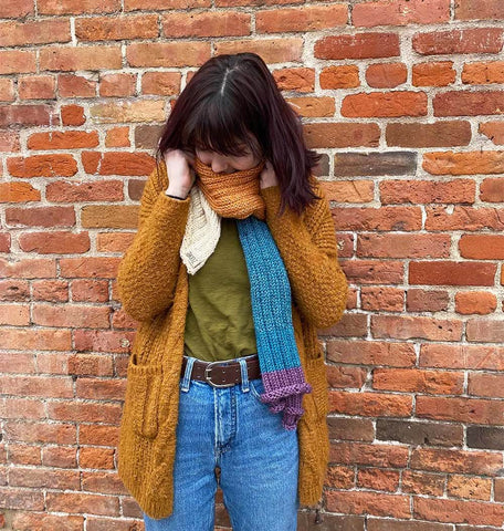 woman wearing rainbow scrappie scarf