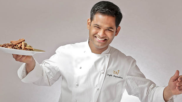 Chef Srijith Gopinathan image smiling with a plate in his hand
