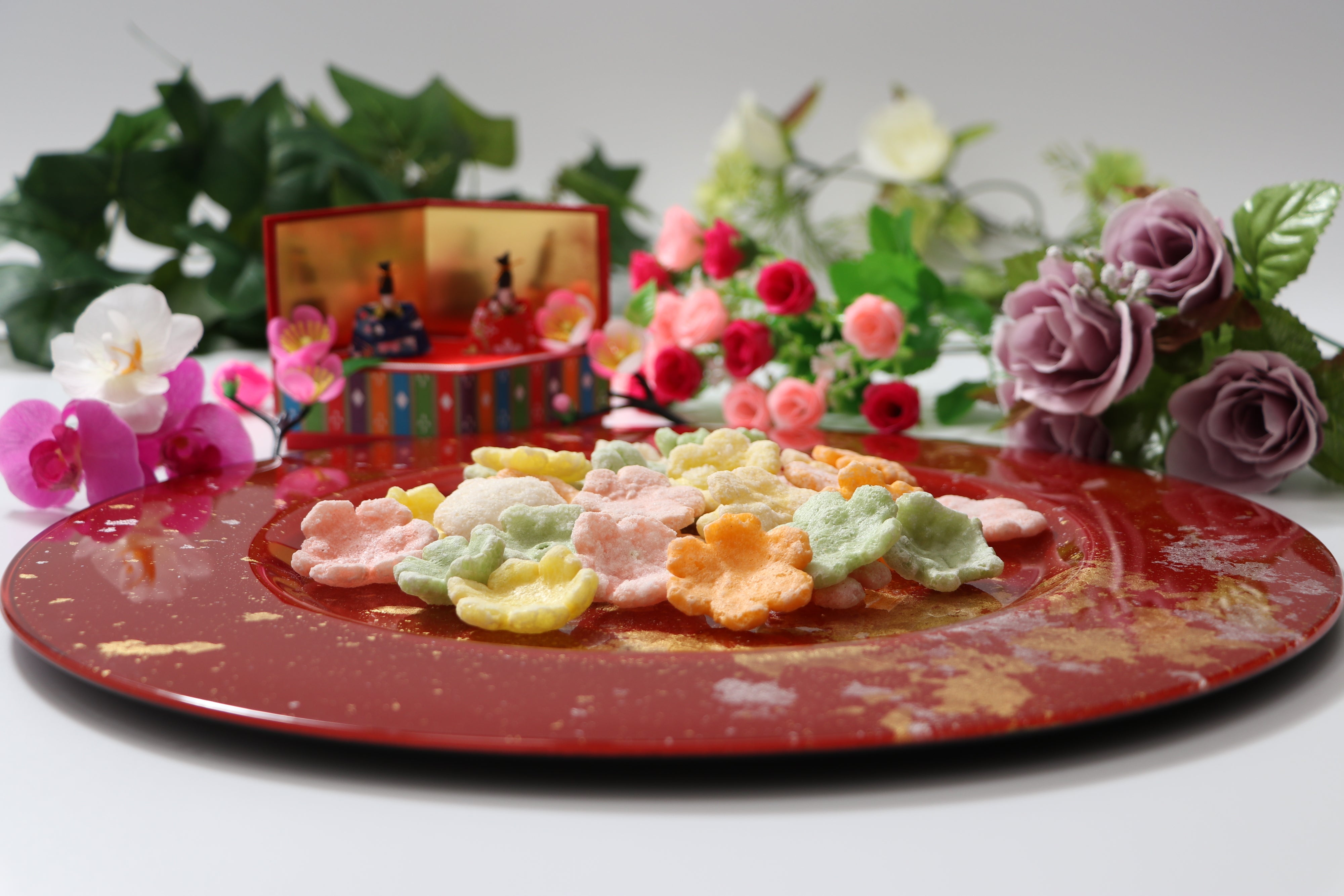 Hina Arare on Syosaku Urushi Glass Charger Plate-L Vermilion with Gold Leaf, Dishwasher Safe.