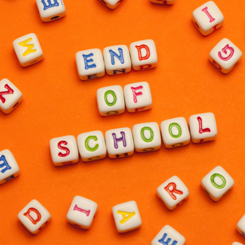 Letters on an orange table spelling "End of School"