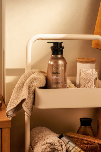 quinoa firming body lotion on rolling cart