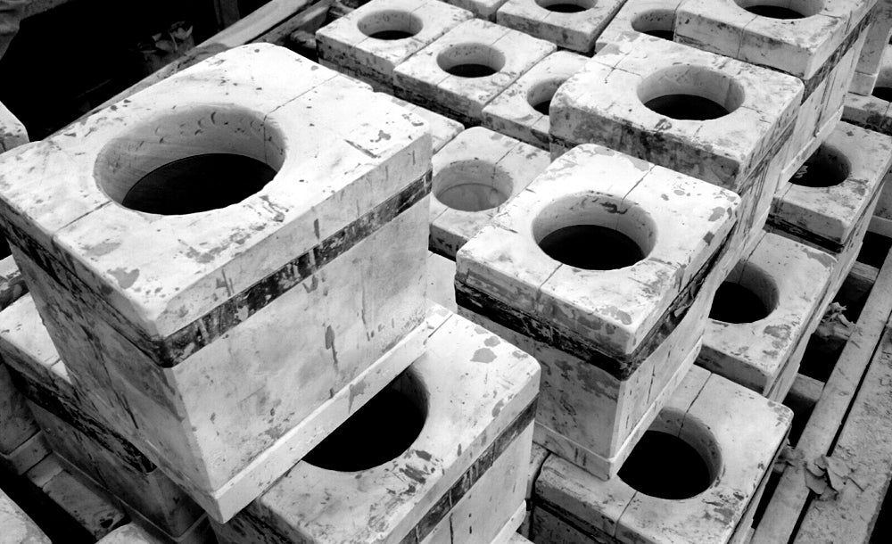 Plaster slip casting moulds held together with car inner tubes