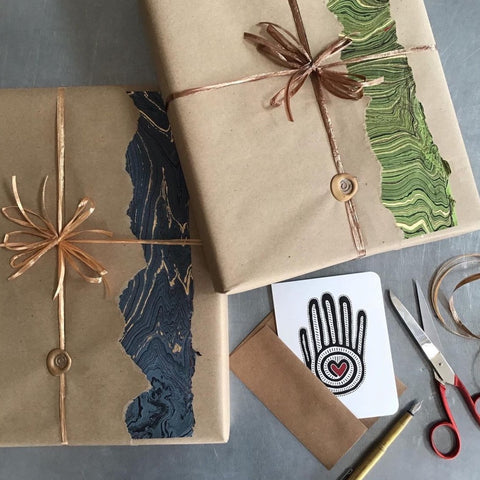 Wrapped gifts with card, scissors and string