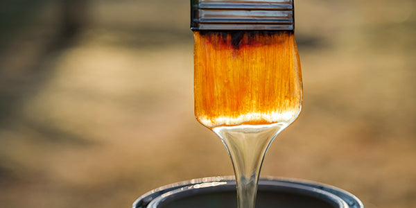 Brush with varnish from a can