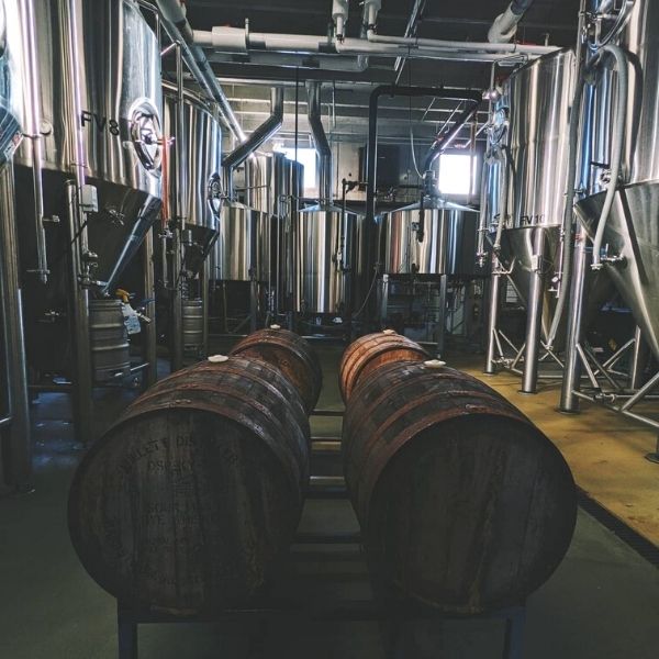 Image of small barrel on table with spirits in the background