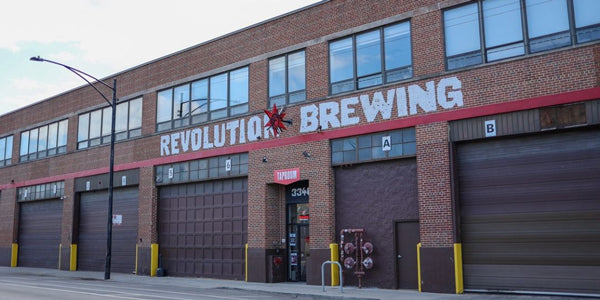 Outside of Revolution Brewing building in Chicago with loading docks and windows