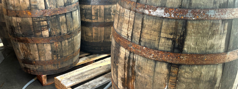 Used whiskey barrels on a pallet