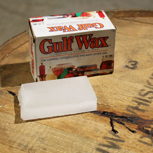 Box of Gulf Wax on top of a barrel head.