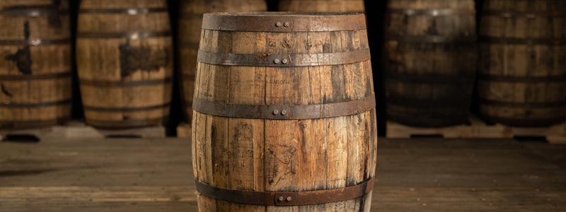 Whiskey barrels in a warehouse