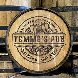 Laser engraved barrel head with text Temmes Pub, Good Beer and Great People and two beer mugs clinking 